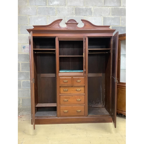 1036 - A late Victorian carved walnut mirrored compactum wardrobe, width 186cm, depth 56cm, height 227cm. C... 