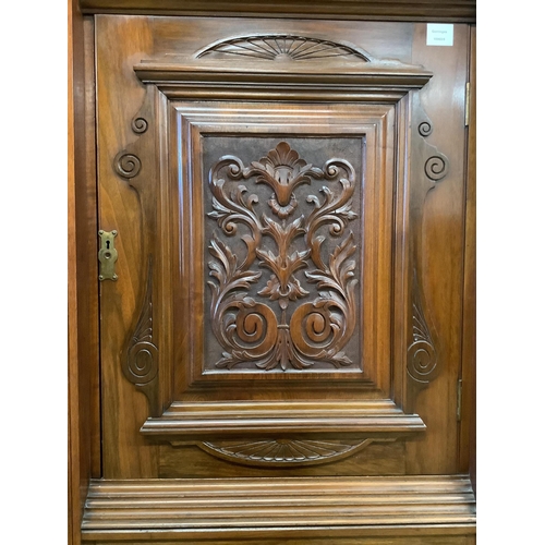 1036 - A late Victorian carved walnut mirrored compactum wardrobe, width 186cm, depth 56cm, height 227cm. C... 