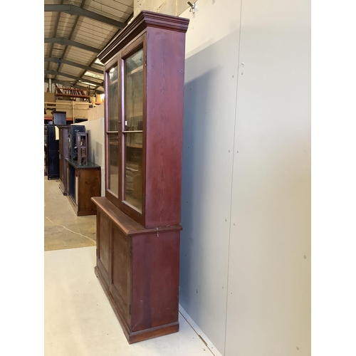 1038 - A late Victorian pine bookcase cupboard, width 130cm, depth 40cm, height 214cm. Condition - poor to ... 