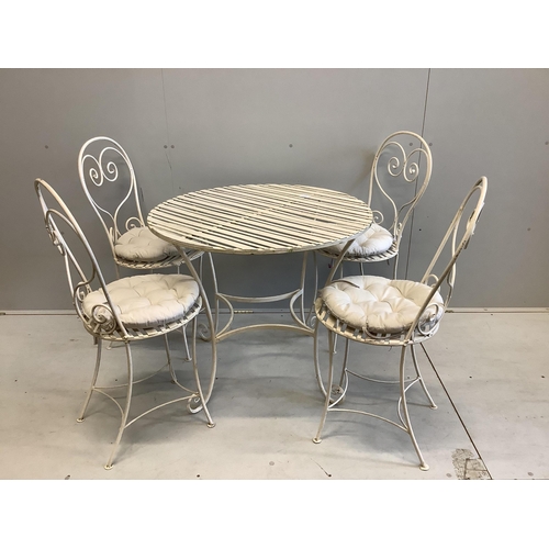 1042 - A Camelia Botnar circular wrought iron garden table, diameter 88cm, height 74cm together with four c... 