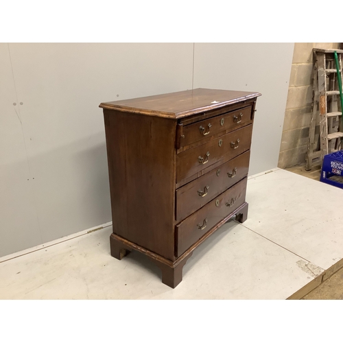 1062 - A mid 18th century feather banded walnut chest, fitted four long drawers, beneath a brushing slide, ... 