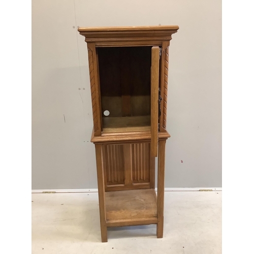 1065 - A Gothic Revival oak cabinet on stand, width 46cm, depth 38cm, height 127cm. Condition - fair