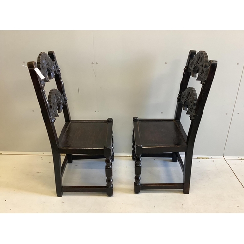 1068 - A pair of Derbyshire style oak side chairs, width 48cm, depth 41cm, height 102cm. Condition - fair... 