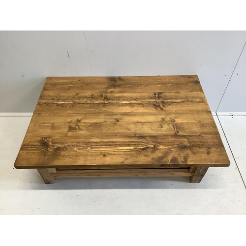 1078 - A rectangular pine two tier coffee table, width 129cm, depth 88cm, height 46cm. Condition - good... 