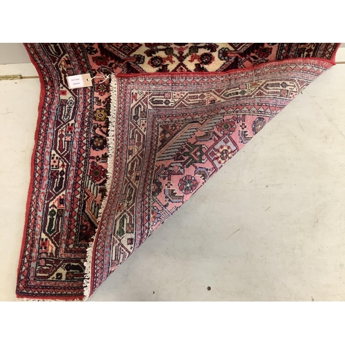 1080 - A North West Persian pink ground runner, 290 x 82cm. Condition - good