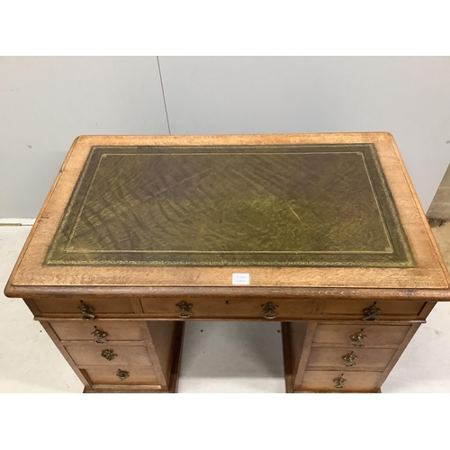 1083 - A late Victorian oak pedestal desk, width 106cm, depth 65cm, height 71cm. Condition - fair