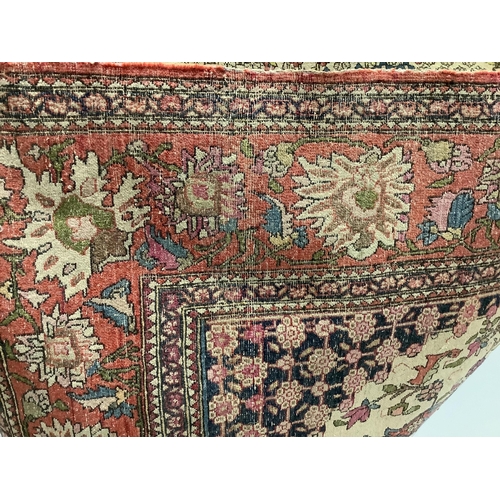 1085 - A North West Persian ivory ground rug, 200 x 139cm. Condition - poor to fair