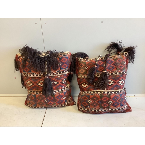 1086 - Two Kilim polychrome camel bags, now as cushions, each 65 x 60cm. Condition - fair