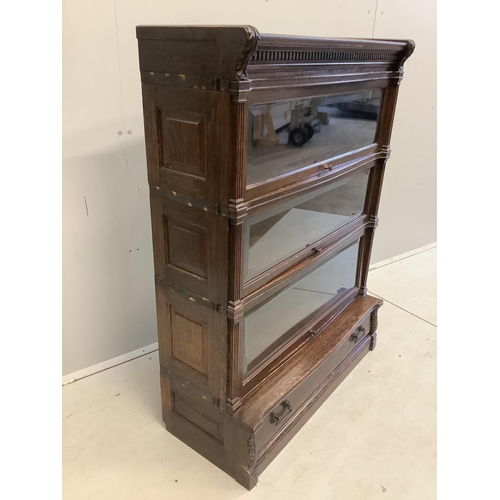 1093 - A Globe Wernicke oak three section bookcase, width 90cm, depth 38cm, height 121cm. Condition - fair... 