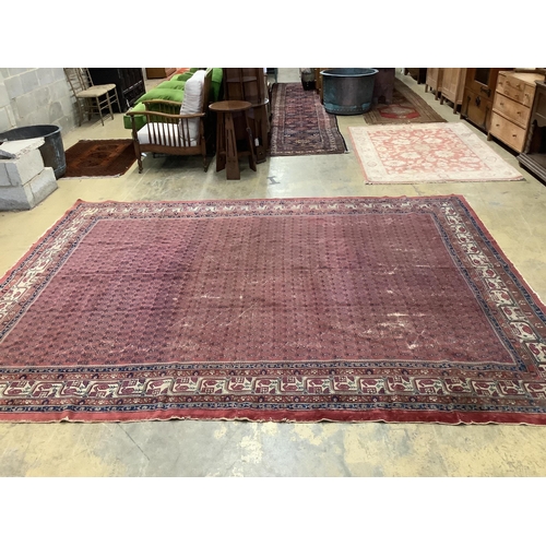 1097 - A Salouk red ground carpet, 350 x 265cm. Condition - poor to fair