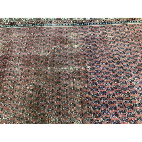 1097 - A Salouk red ground carpet, 350 x 265cm. Condition - poor to fair