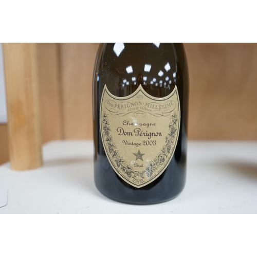 1251 - A 2003 vintage bottle of Dom Perignon champagne. Condition - fair to good, minor label wear, etc.... 