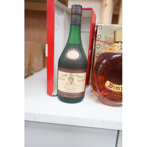 1274 - Four bottles of various alcohols comprising a bottle of 50cl Hennessey Fine Champagne Cognac,  Plant... 