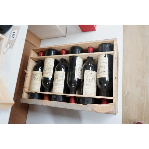 1275 - A case of twelve Chateau La Lagune, Haut-Medoc, 1982, France, OWC. Condition - fair, lacking cover. ... 