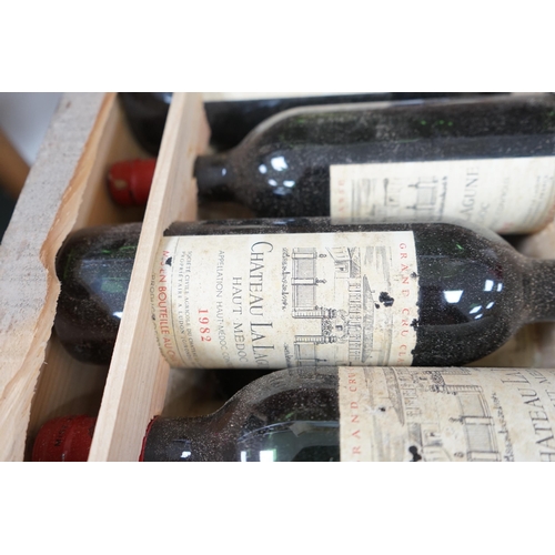 1275 - A case of twelve Chateau La Lagune, Haut-Medoc, 1982, France, OWC. Condition - fair, lacking cover. ... 