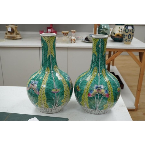 1282 - A pair of modern Chinese leaf and butterfly decorated bottle vases, 37cm high. Condition - good... 