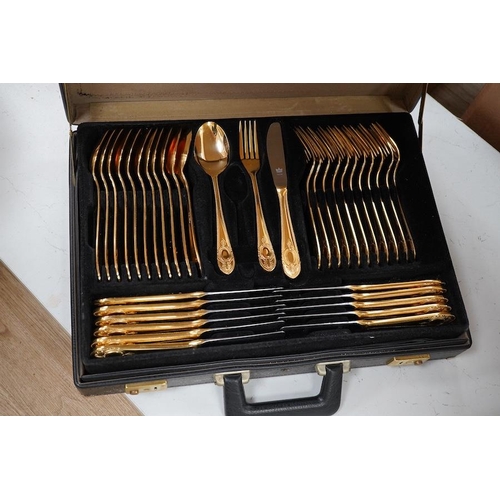 1297 - A Bestecke Solingen gold plated canteen of cutlery. Condition - good, one piece missing