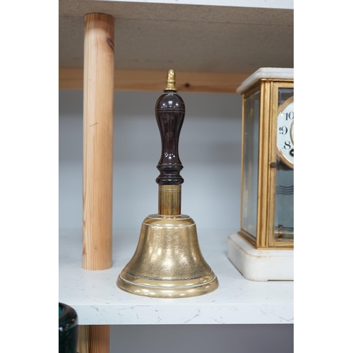 1306 - A late 19th/early 20th century brass school bell, with a turned mahogany handle, bell diameter 12.5c... 