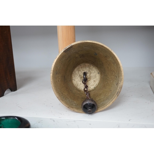 1306 - A late 19th/early 20th century brass school bell, with a turned mahogany handle, bell diameter 12.5c... 