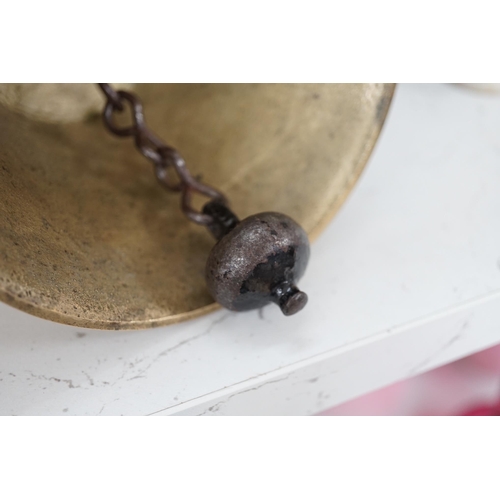 1306 - A late 19th/early 20th century brass school bell, with a turned mahogany handle, bell diameter 12.5c... 