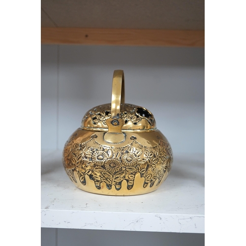 1309 - A Chinese brass basket censer and cover, 13cm high. Condition - fair.