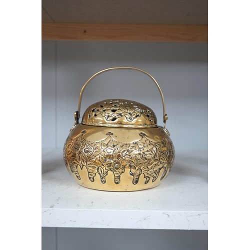 1309 - A Chinese brass basket censer and cover, 13cm high. Condition - fair.