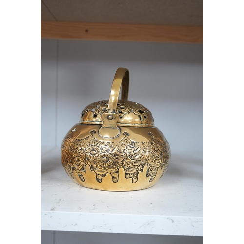 1309 - A Chinese brass basket censer and cover, 13cm high. Condition - fair.