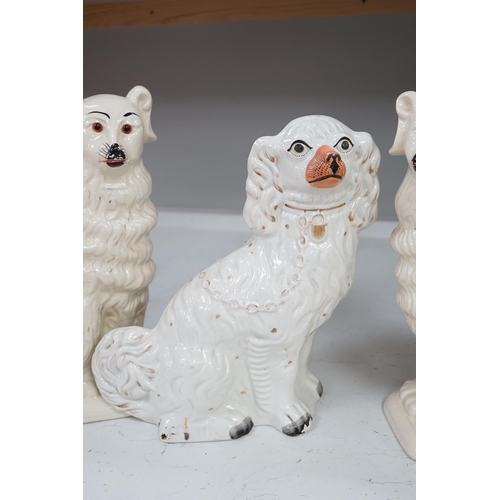 1319 - A pair of rare Staffordshire models of collies and a Victorian pottery models of a spaniel, tallest ... 