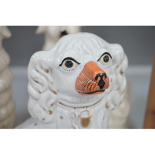 1319 - A pair of rare Staffordshire models of collies and a Victorian pottery models of a spaniel, tallest ... 