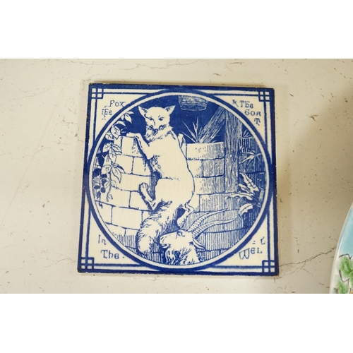 1322 - Two Minton pottery Arts and Crafts fireplace tiles, printed in blue and white, with scenes from Aeso... 