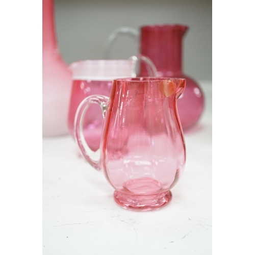 1326 - A pair of Victorian pink satin long necked vases, 25cm high, and five pieces of cranberry coloured g... 