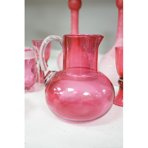 1326 - A pair of Victorian pink satin long necked vases, 25cm high, and five pieces of cranberry coloured g... 