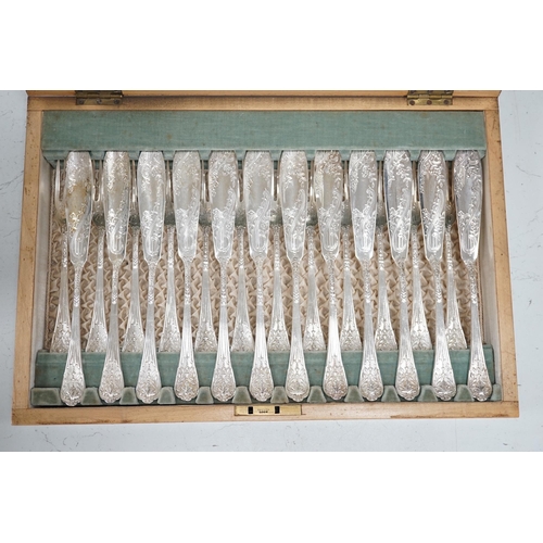 1329 - A set of twelve plated and engraved fish knives and forks, together with a pair of servers, housed i... 