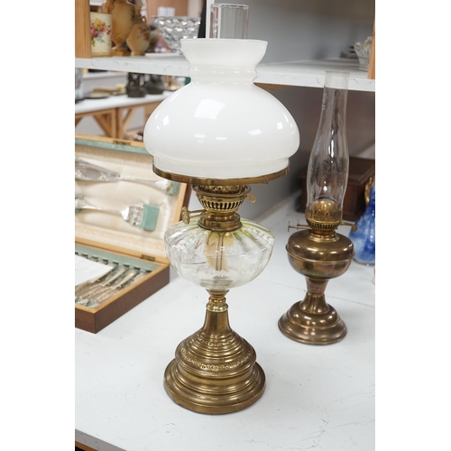 1330 - A late 19th century brass oil lamp with painted bowl and opaque shade together with a later oil lamp... 