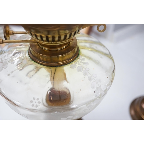 1330 - A late 19th century brass oil lamp with painted bowl and opaque shade together with a later oil lamp... 