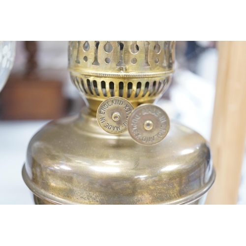 1330 - A late 19th century brass oil lamp with painted bowl and opaque shade together with a later oil lamp... 