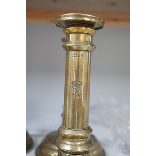 1341 - Six Victorian/William IV government issue brass candlesticks, five engraved with cipher crown and nu... 