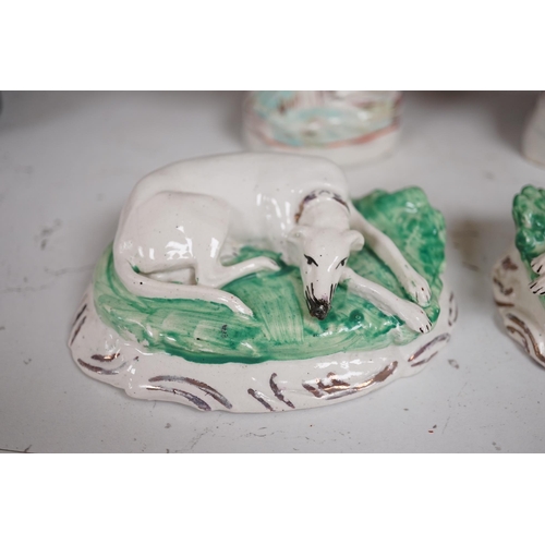 1344 - A pair of mid 19th century Staffordshire figures of recumbent greyhounds, 11 cm wide and a pair of s... 