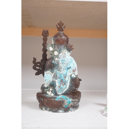 1345 - A Tibetan bronze Padmasambhava Buddhist figure, 29.5cm high. Condition - poor to fair.