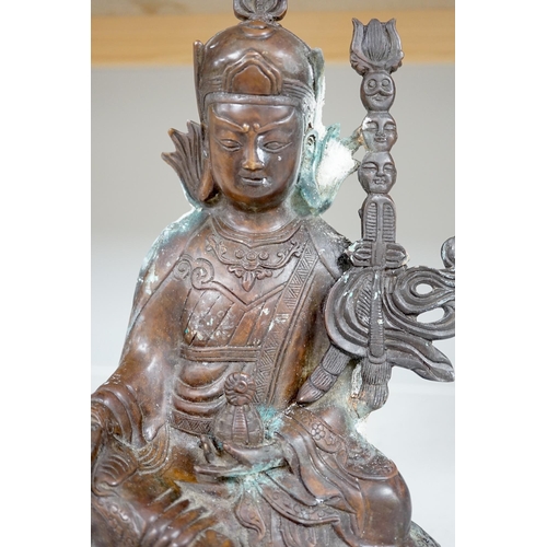 1345 - A Tibetan bronze Padmasambhava Buddhist figure, 29.5cm high. Condition - poor to fair.