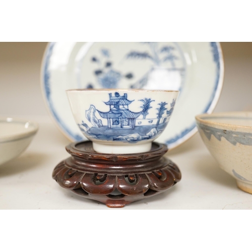 1348 - A Chinese blue and white plate, a tea bowl, two pottery bowls and a wooden stand (5). Condition - fa... 