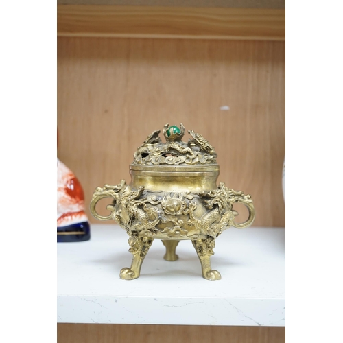 1355 - A Chinese bronze lidded censer, with jade bead insert in the finial, 15cm high. Condition - good.... 