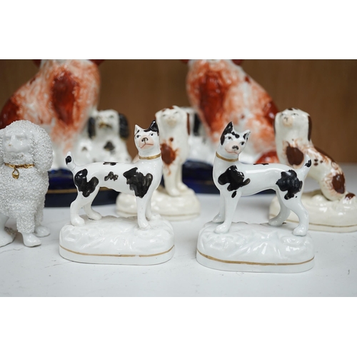 1356 - A pair of mid 19th century Staffordshire spaniel and puppy groups, a pair of smaller Staffordshire s... 