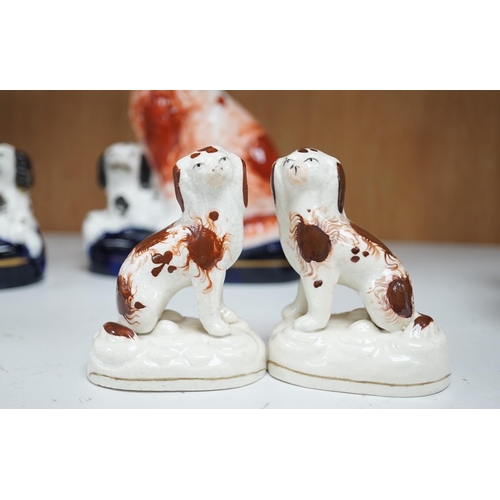 1356 - A pair of mid 19th century Staffordshire spaniel and puppy groups, a pair of smaller Staffordshire s... 