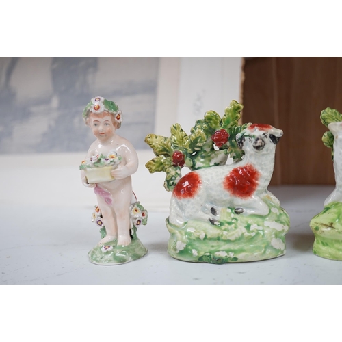 1358 - A pair of early 19th century pearlware models of sheep, an English porcelain sheep ring tree and a... 