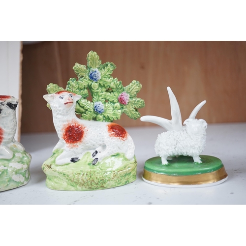 1358 - A pair of early 19th century pearlware models of sheep, an English porcelain sheep ring tree and a... 