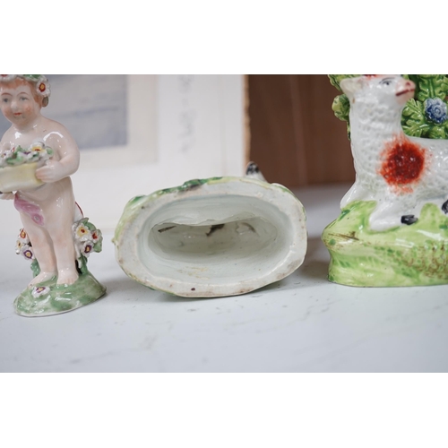 1358 - A pair of early 19th century pearlware models of sheep, an English porcelain sheep ring tree and a... 