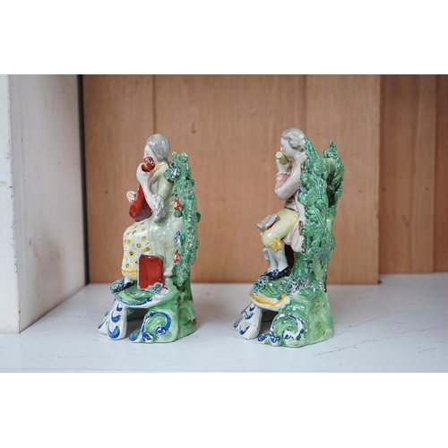 1362 - A pair of early 19th century pearlware groups of seated musicians with dogs, 15.5 cm high, Condition... 