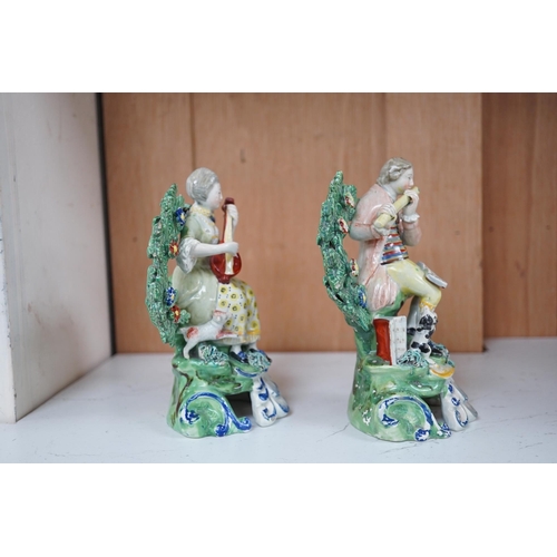 1362 - A pair of early 19th century pearlware groups of seated musicians with dogs, 15.5 cm high, Condition... 