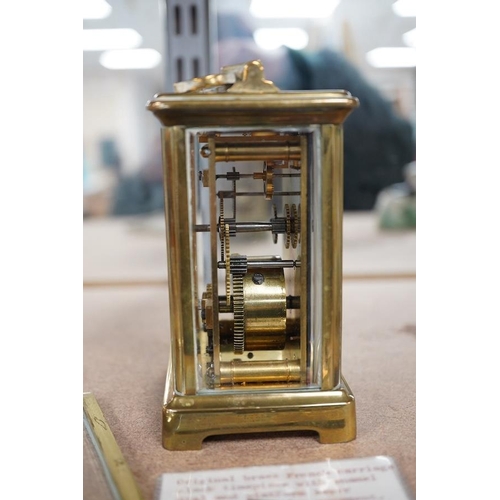 1383 - A late 19th century French brass cased eight day carriage timepiece with key, 14cm high. Condition -... 